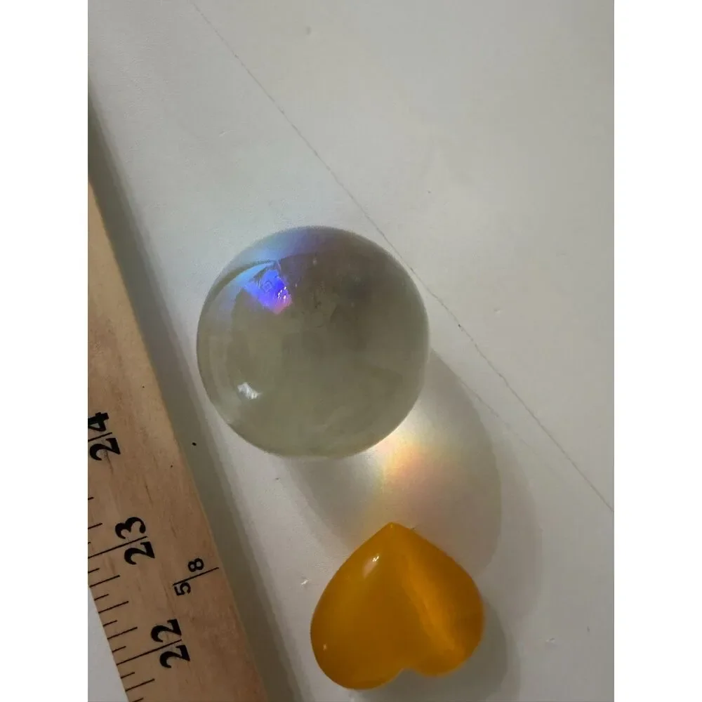 pottery bowl with clear crystal sphere and yellow cats eye heart gemstone